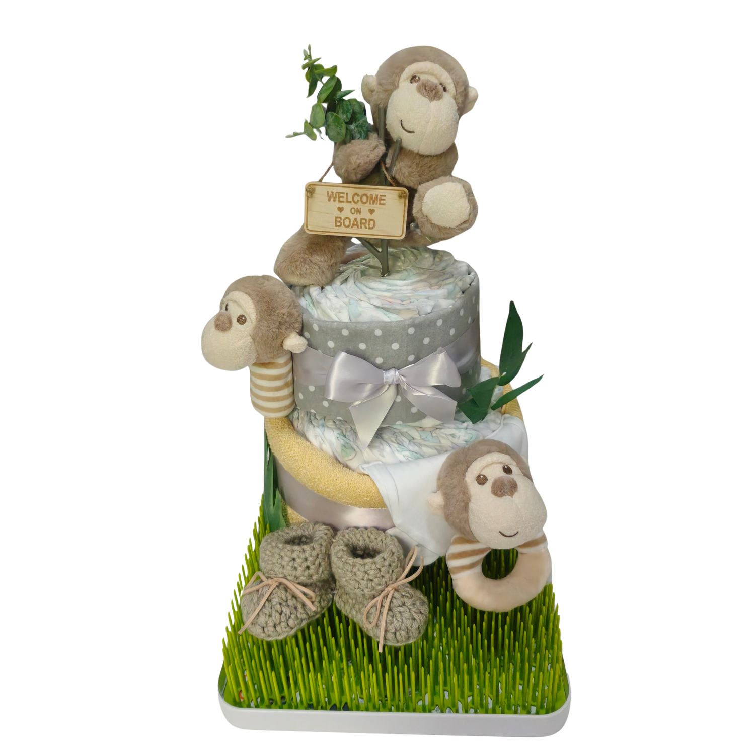 Cute cheeky monkey welcome nappy cake baby shower gift decorated with nappies ribbons and toy