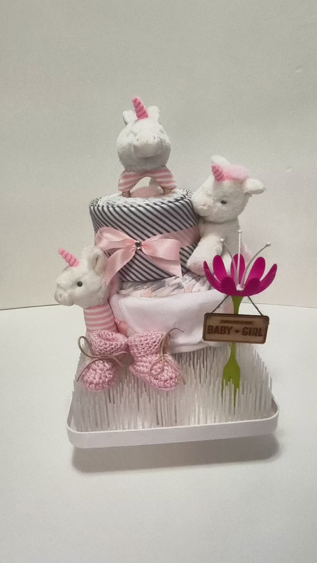 magical unicorn dream nappy cake limited edition baby gift with rolled nappies ribbons and plush toy