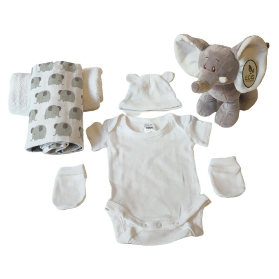 Flat lay of Ellie elephant 2-tier nappy cake components, including an eco-friendly plush toy, elephant print wrap, white infant bodysuit, beanie, and mittens.