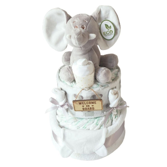 Ellie silver 2-tier baby elephant nappy cake gift set featuring an eco-friendly plush toy, wooden Welcome on Board sign, patterned muslin wrap, and silver ribbon trim.