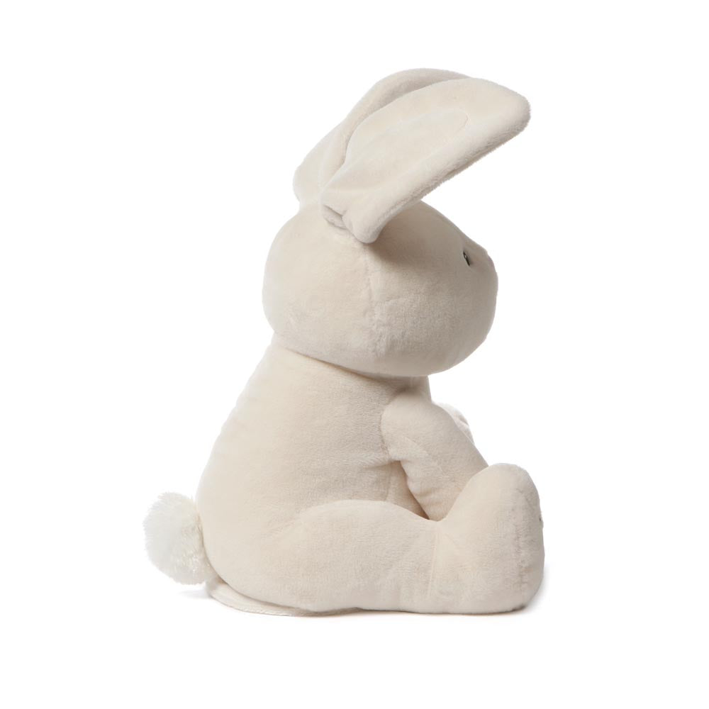 Right side view of GUND Flora Bunny animated plush with raised ear and soft cream fur