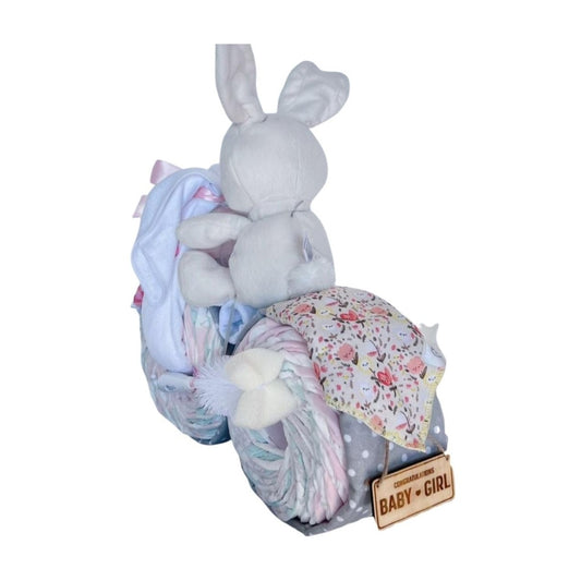 Bunny Motorbike Nappy Cake with plush bunny, baby bottle, floral bib, premium baby essentials.
