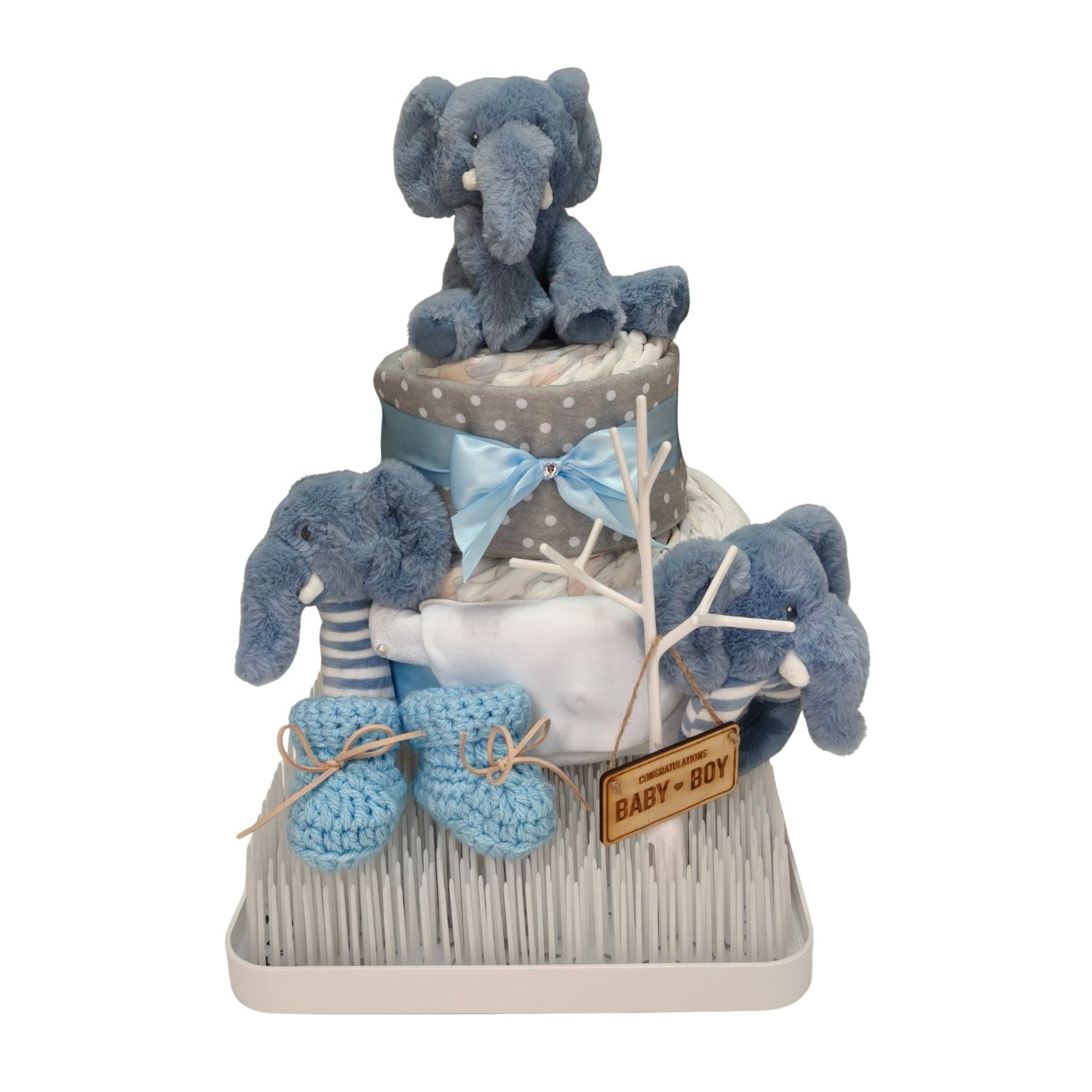 Limited Edition Gentle Elephant Blessing two-tier baby boy nappy cake gift set featuring blue plush elephant toys, baby booties, and a wooden Congratulations Baby Boy sign.