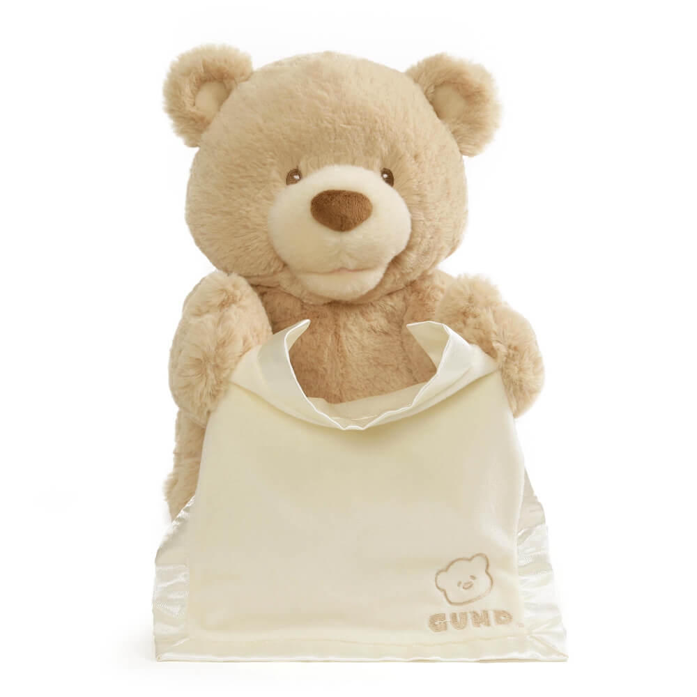GUND Peek-a-Boo Bear plush toy close-up showing the teddy bear's embroidered face.