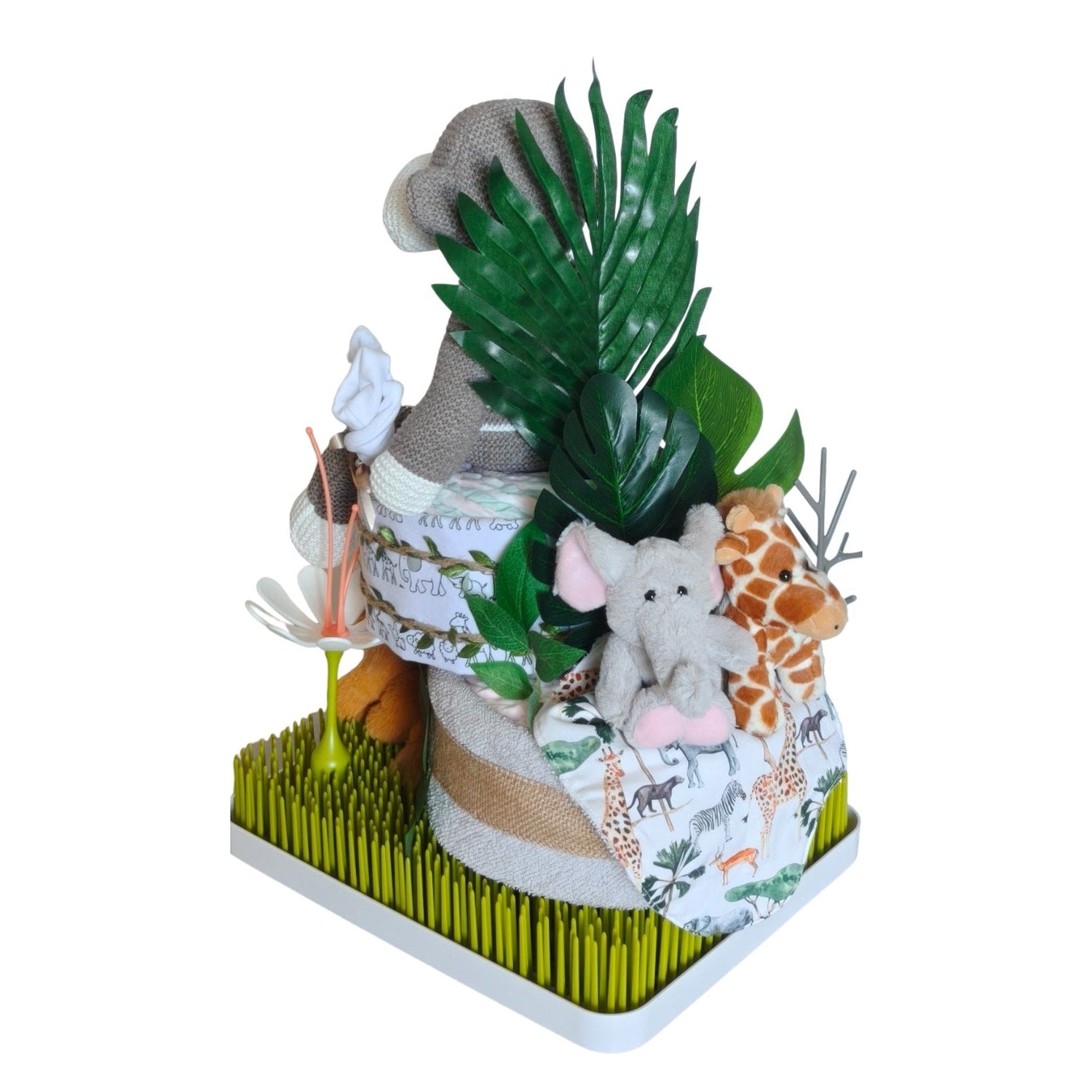 Rear view of the  Monkey in the jungle-themed nappy cake with knitted monkey, plush giraffe, jungle leaf décor and Boon Grass drying rack.
