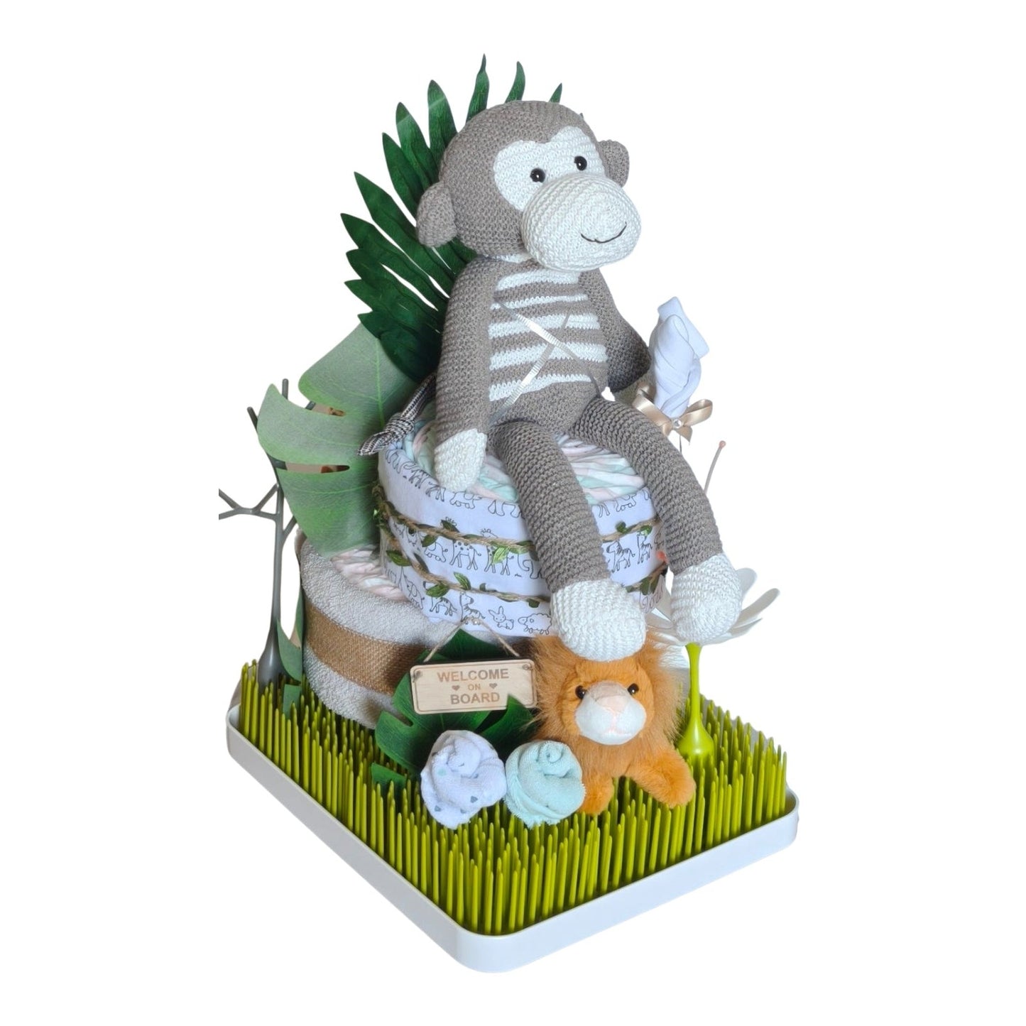 Front view of Monkey in the jungle themed nappy cake with knitted monkey, plush lion, Boon Grass drying rack premium baby gift essentials.