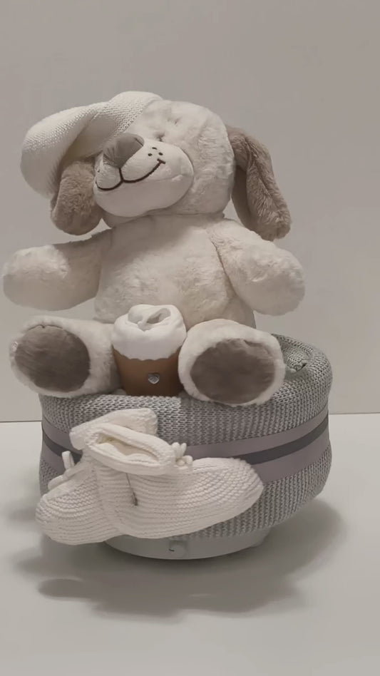 white puppy nappy cake limited edition baby gift with rolled nappies ribbons and plush toy