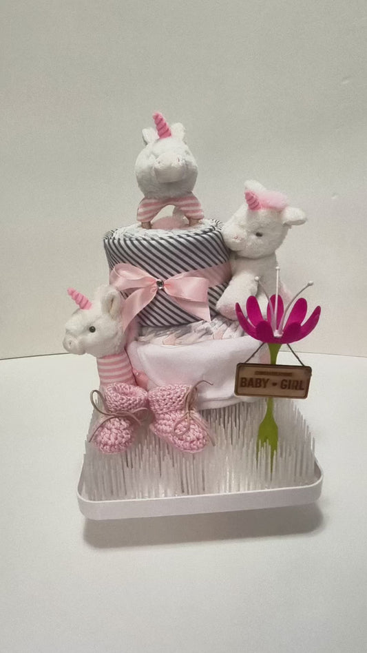 magical unicorn dream nappy cake limited edition baby gift with rolled nappies ribbons and plush toy