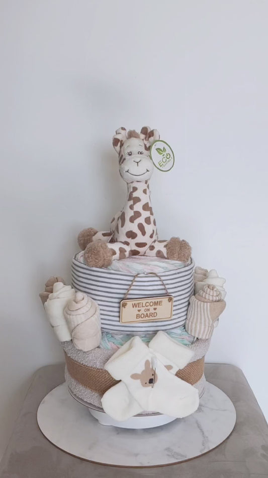 Video of the 2-Tier Giraffe Nappy Cake featuring an eco-friendly plush giraffe, baby socks, premium newborn essentials.