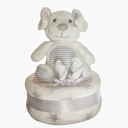 Unisex puppy dog baby nappy cake gift set, including a striped plush puppy toy, baby mittens, and a star-patterned receiving blanket wrapped in a grey ribbon.