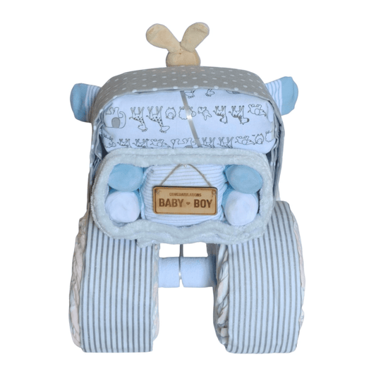 Back view of a blue baby boy truck nappy cake gift set showing striped wheels, a safari animal print wrap, and a wooden Baby Boy sign.