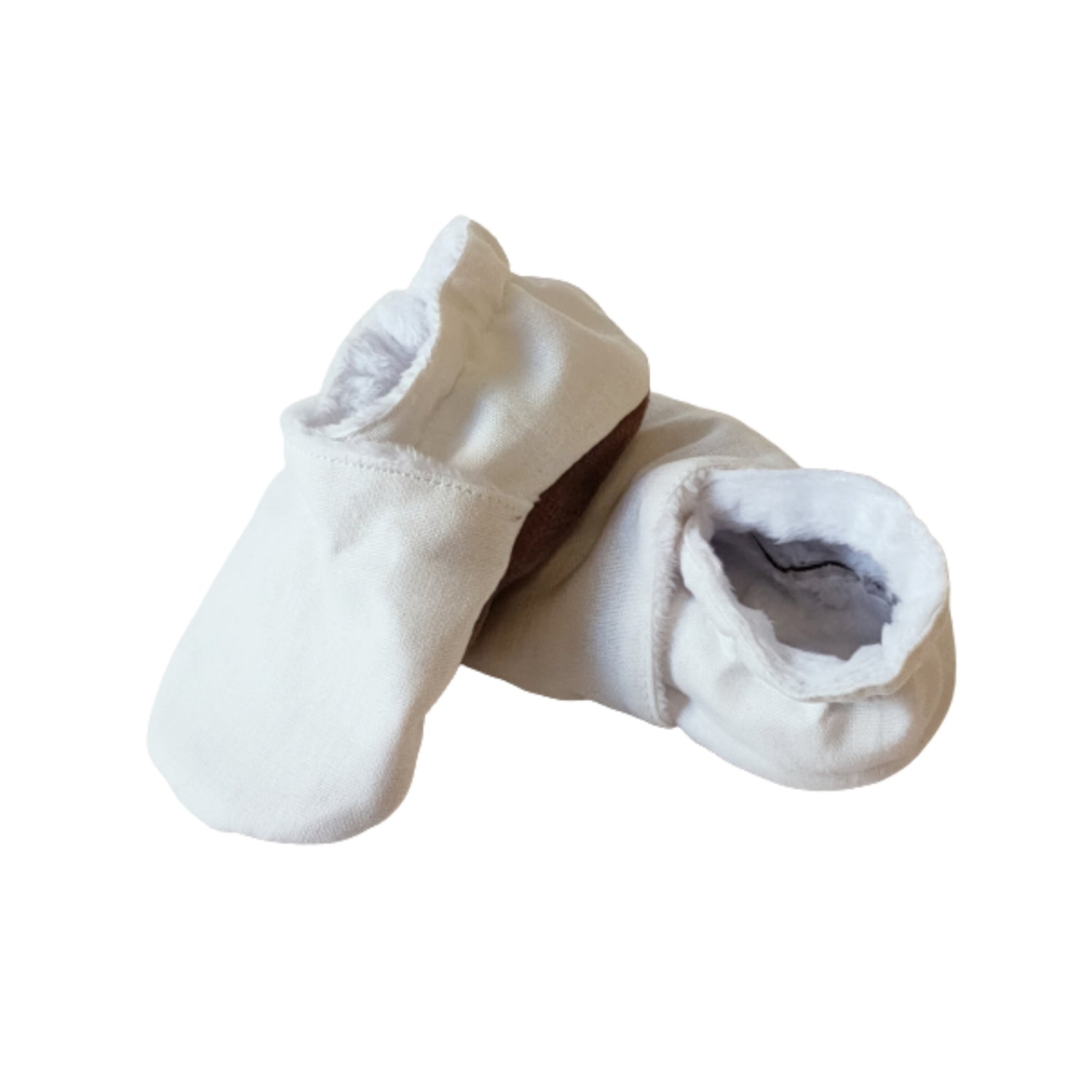 Soft white slip-on baby booties included in the green leaf owl nappy cake gift set.